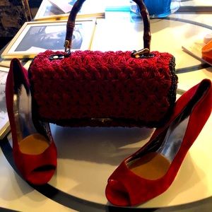 Red bag and suede shoe